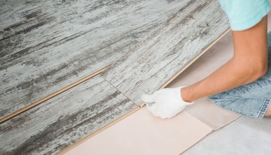 installer putting lvp down in a home
