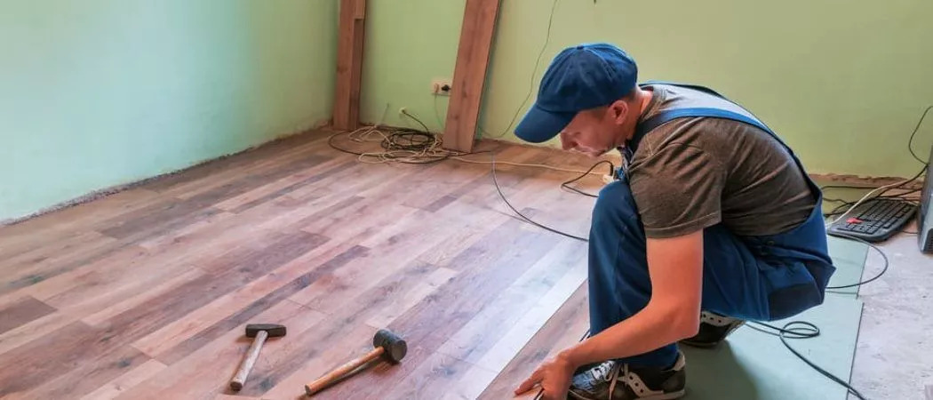 man installing hardwood floors