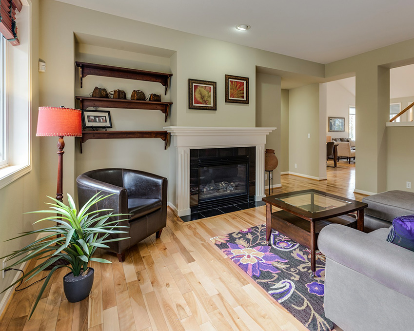 natural cabin grade floors in a living room with a purple rug