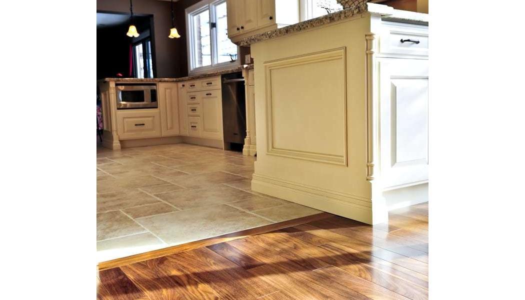tile and wood floors meet at the kitchen