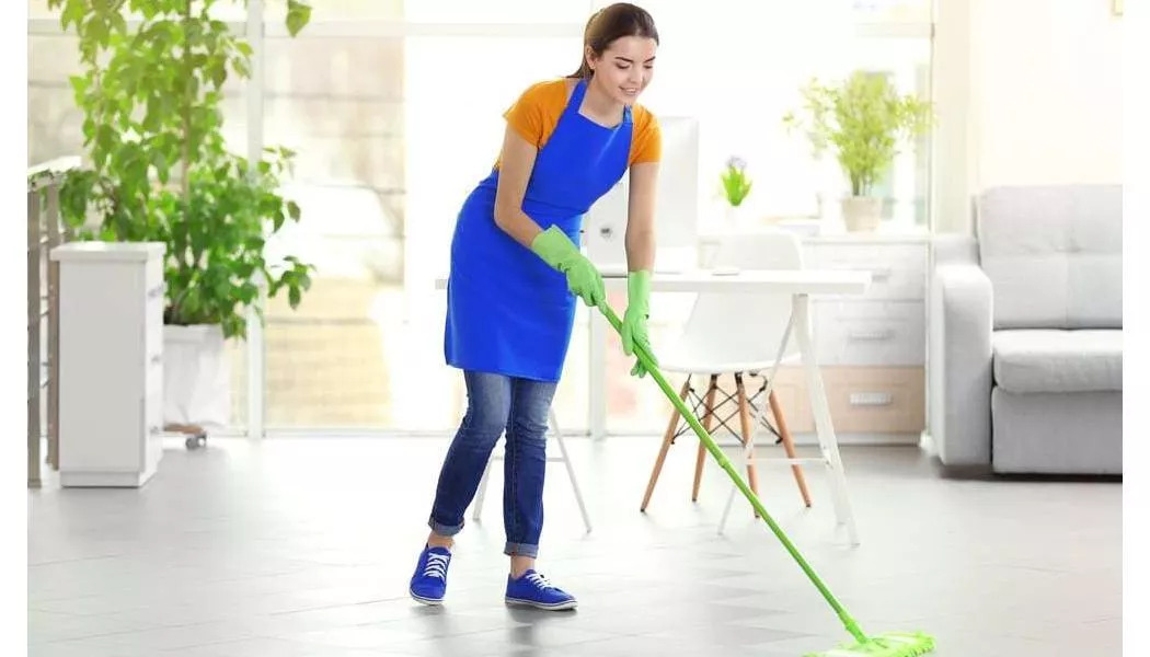 woman cleaning her hard surface floor