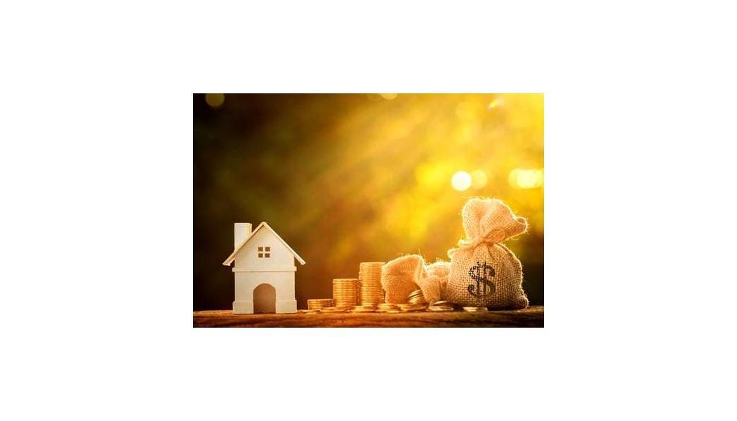 little home next to coins and a money bag